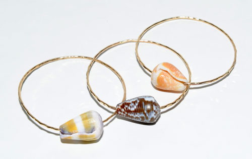 MISHA HAWAII bangles with shell $66 each Available at Fighting Eel, 629